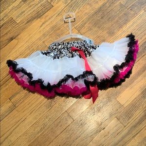 Very fluffy tutu with white, black, and pink